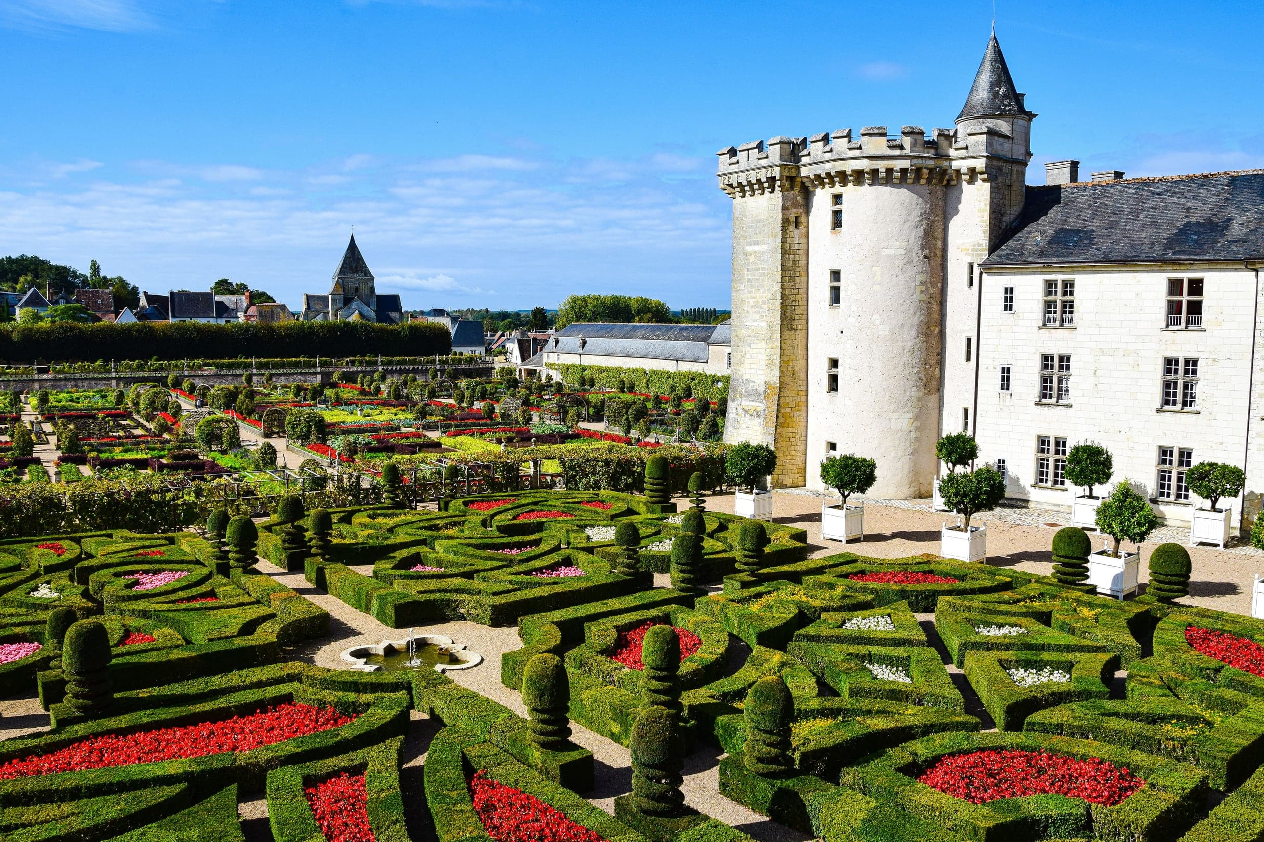 Geometric gardens below the white towers of Chateau de Villandry