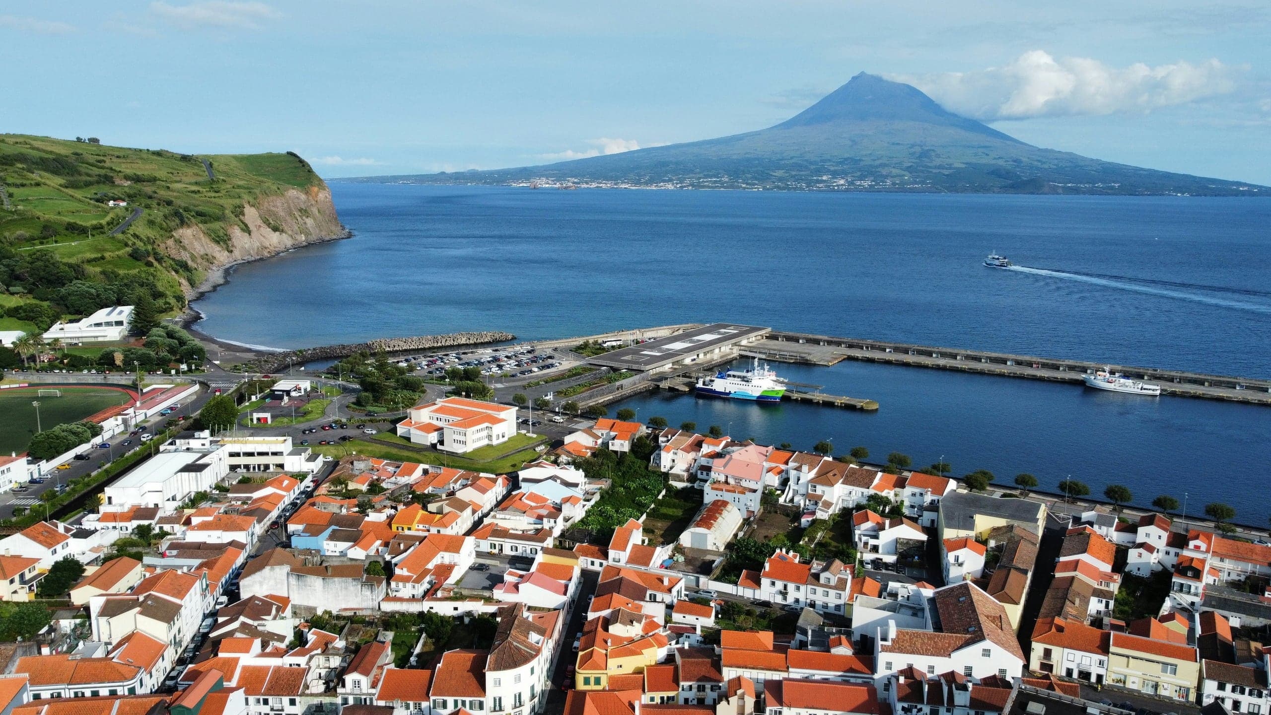 Horta's harbor and red-roofed center facing Pico across the channel